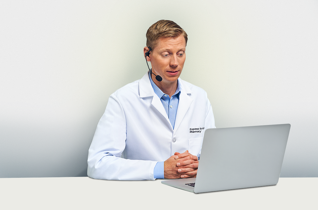 An Express Scripts® Pharmacy pharmacist speaks with a patient on the phone.