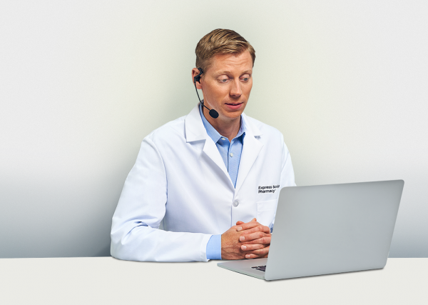 An Express Scripts® Pharmacy pharmacist speaks with a patient on the phone.